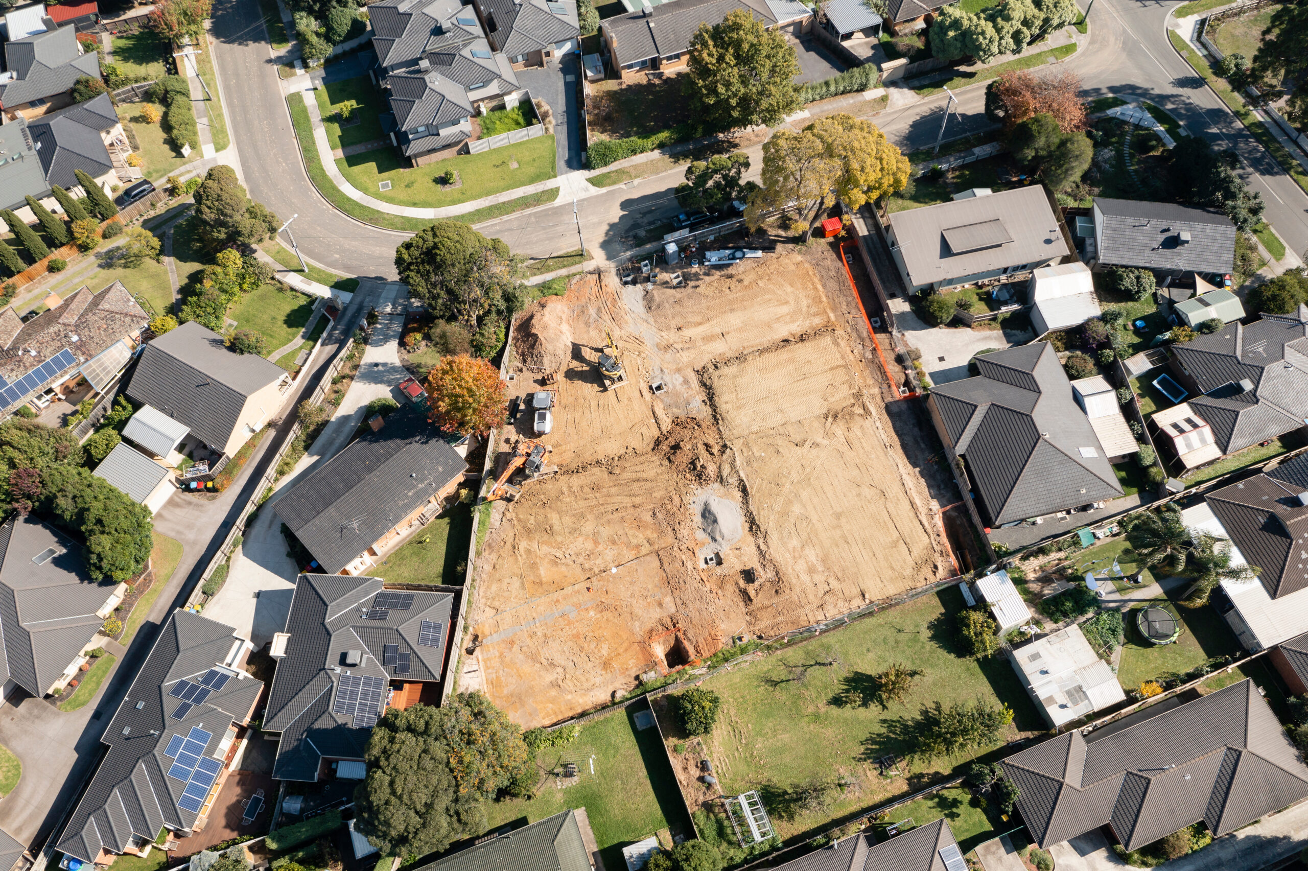 Aerial view of land under development in a neighborhood